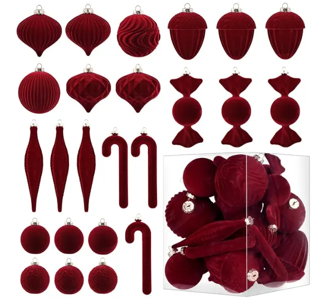 assorted burgundy Christmas ornaments set including velvet balls, ribbed ornaments, candy-shaped ornaments, elongated drops, and candy cane decorations, displayed with a clear storage box