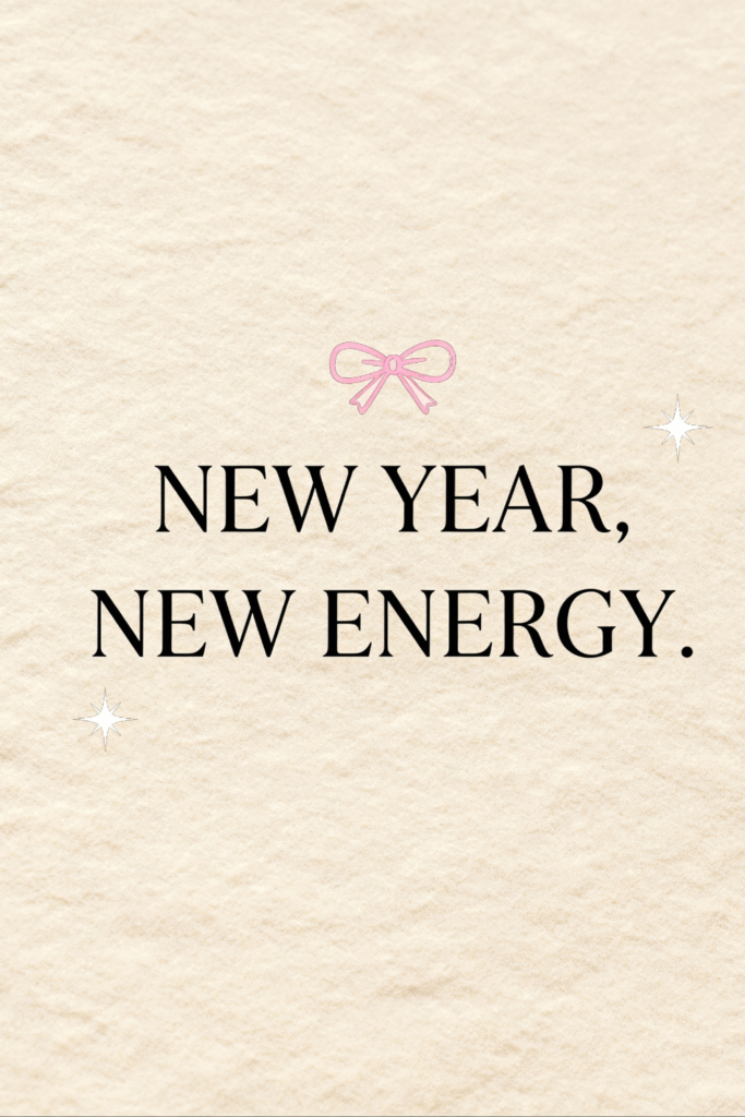 cream paper-texture wallpaper with small pink bow and bold serif quote “new year new energy”