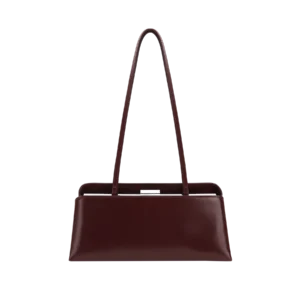 Slim burgundy handbag with elongated double straps and minimalist silhouette — refined and versatile accessory.